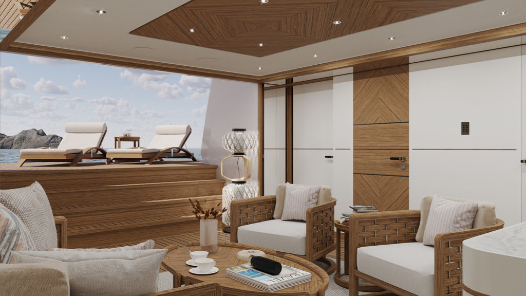 Luxurious yacht interior featuring wicker chairs with cushions, a wooden coffee table with cups and a magazine, and outdoor sun loungers overlooking the ocean and a distant rocky island.