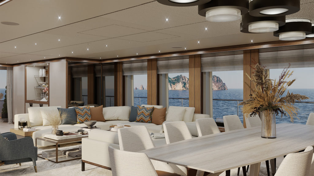 Luxurious yacht interior featuring a spacious lounge area with cream-colored sofas and colorful pillows, a dining table with elegant chairs, and large windows offering a scenic ocean view with rocky islands in the distance. The ceiling is adorned with modern circular lights, and a decorative bouquet of dried plants is on the table.