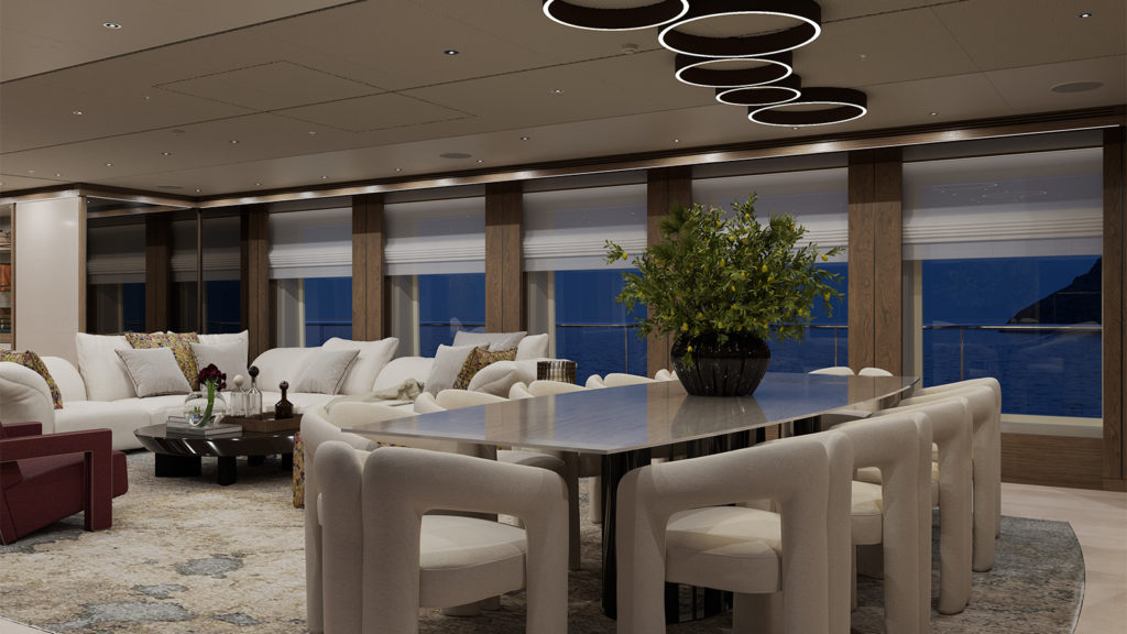 Luxurious interior of a yacht with a modern dining area featuring a long table surrounded by cushioned chairs and a centerpiece of green foliage. The space is elegantly lit with circular ceiling lights and offers a view of the ocean through large windows.