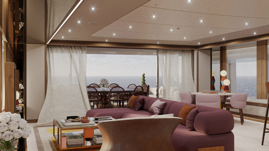 A modern living room with a large purple sectional sofa, wooden coffee table, and bookshelves, overlooking a balcony with a dining table and a view of the ocean. The room features a ceiling with recessed lighting and decorative lamps on a side table.