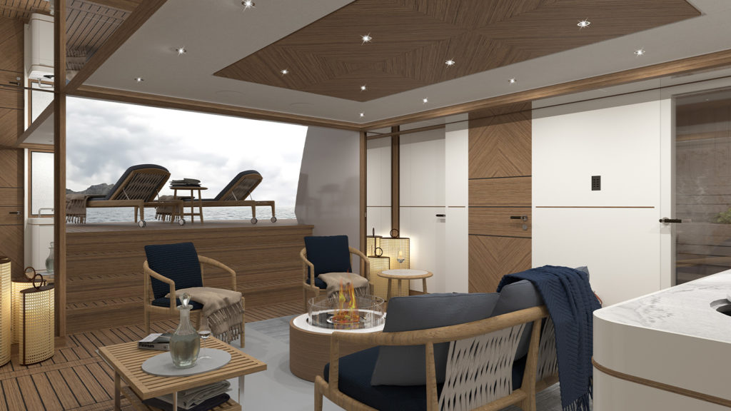 Luxurious yacht interior with wooden accents, featuring comfortable seating around a modern fireplace, a small table with a carafe and glasses, and an outdoor deck with lounge chairs overlooking the ocean.